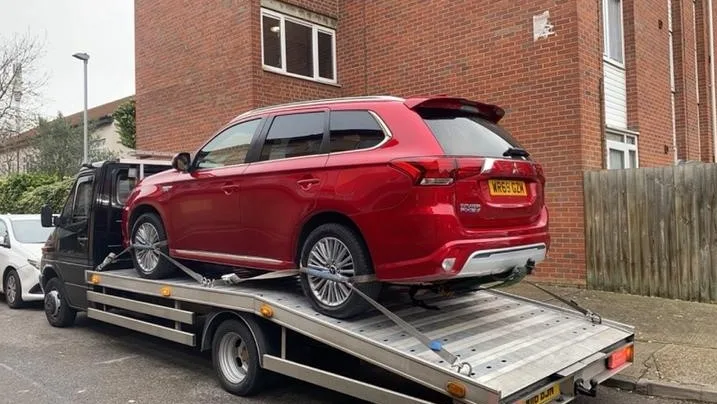 red-car-towing-united-kingdom