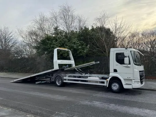 white-recovery-truck-tilted-ramp