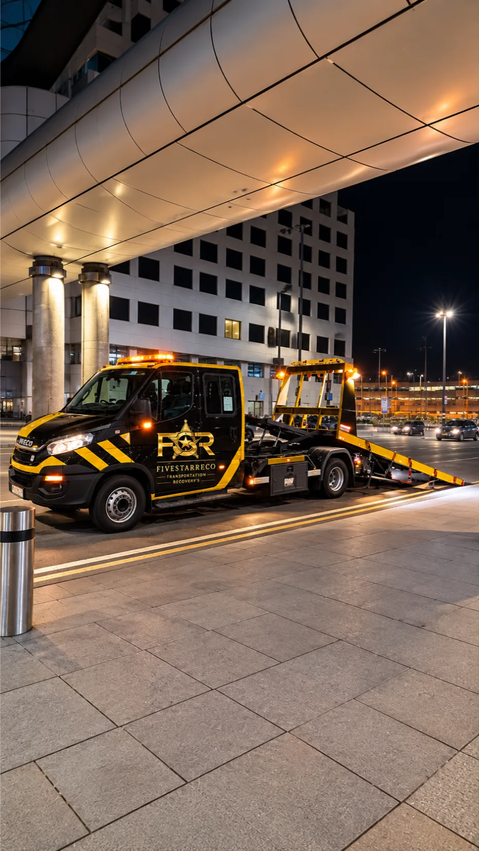 Nighttime IVECO Tow Truck at Modern Terminal